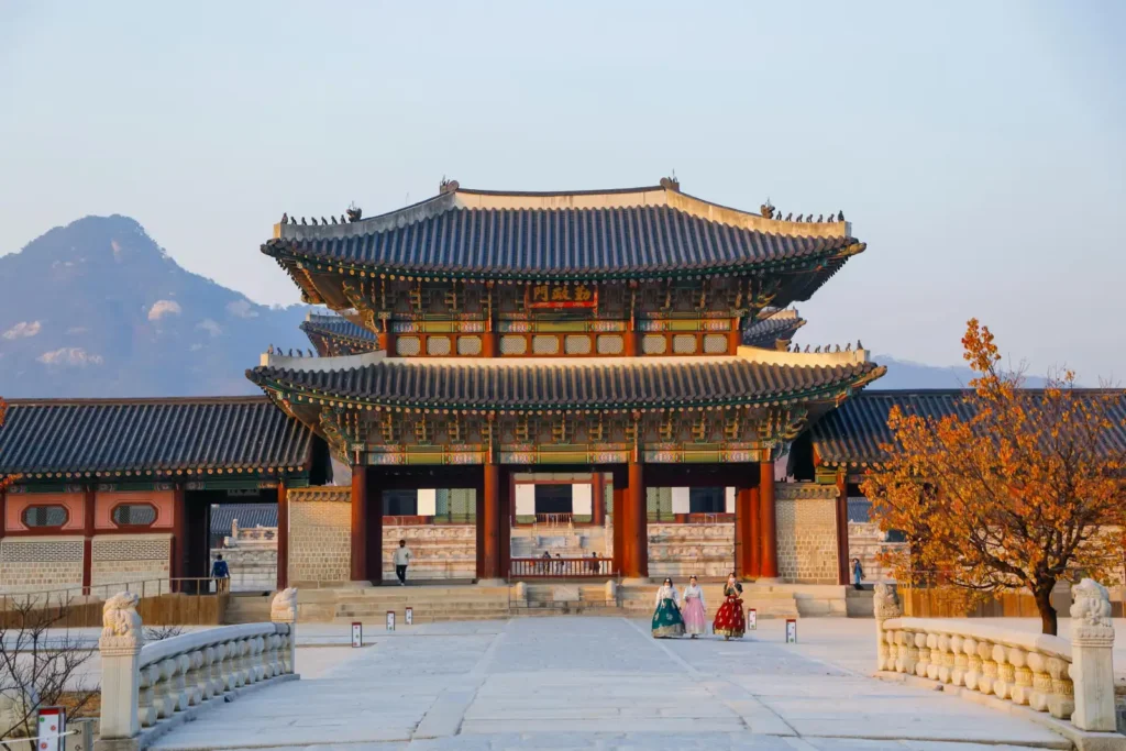 Visitors in hanbok at Gyeongbokgung Palace during Seoul Autumn Hanbok Week